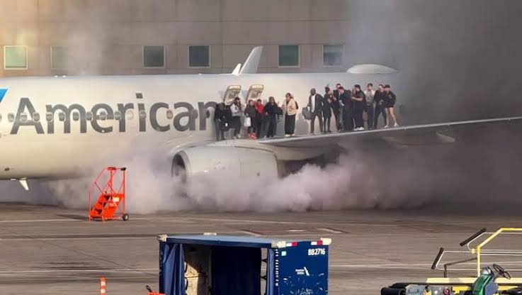 American Airlines passengers escape via wing after plane catches fire